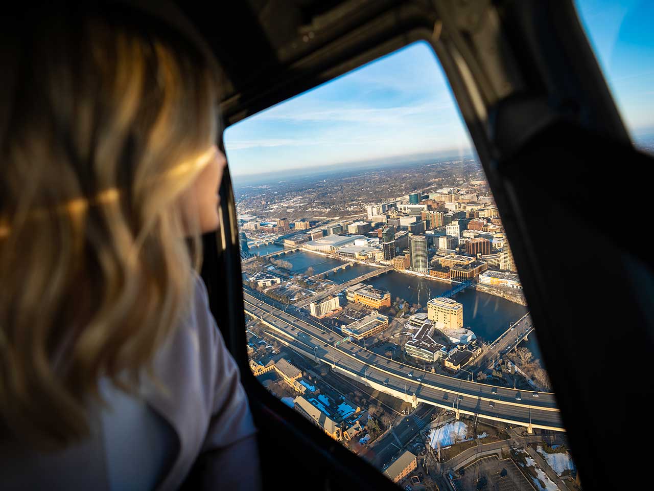 Helicopter passenger flying over Grand Rapids Michigan