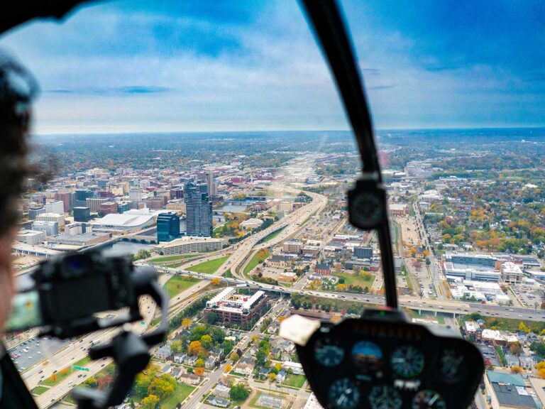 Helicopter cockpit view flying over Grand Rapids Michigan