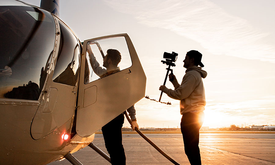 helicopter photographer at sunset