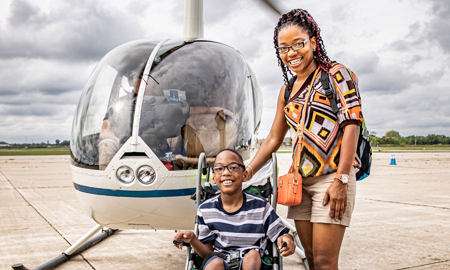 mom and son take a helicopter flight