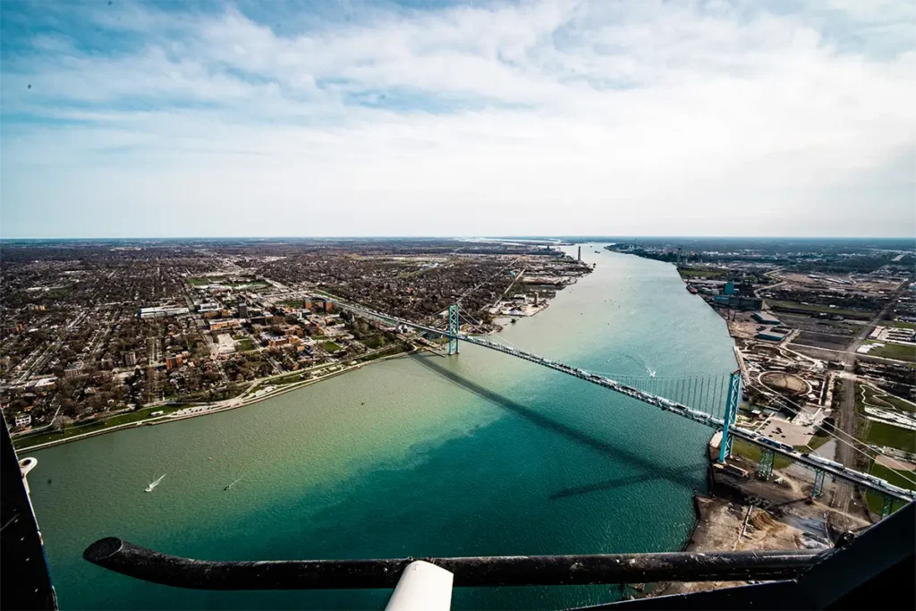 a view of the ambassador bridge taken from a helicopter in the summer