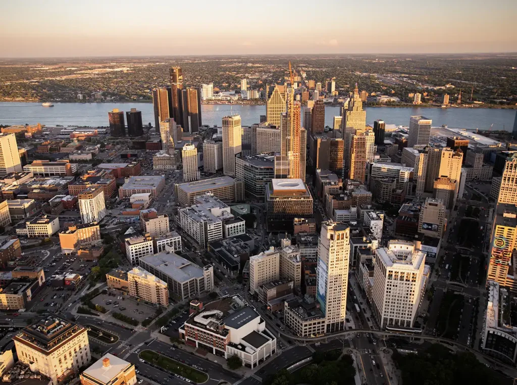 a sunset view of downtown detroit from a helicopter