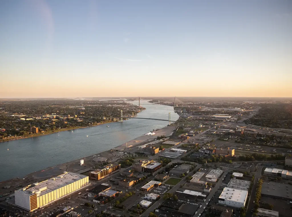 the detroit river during a sunset taken from a helicopter tour