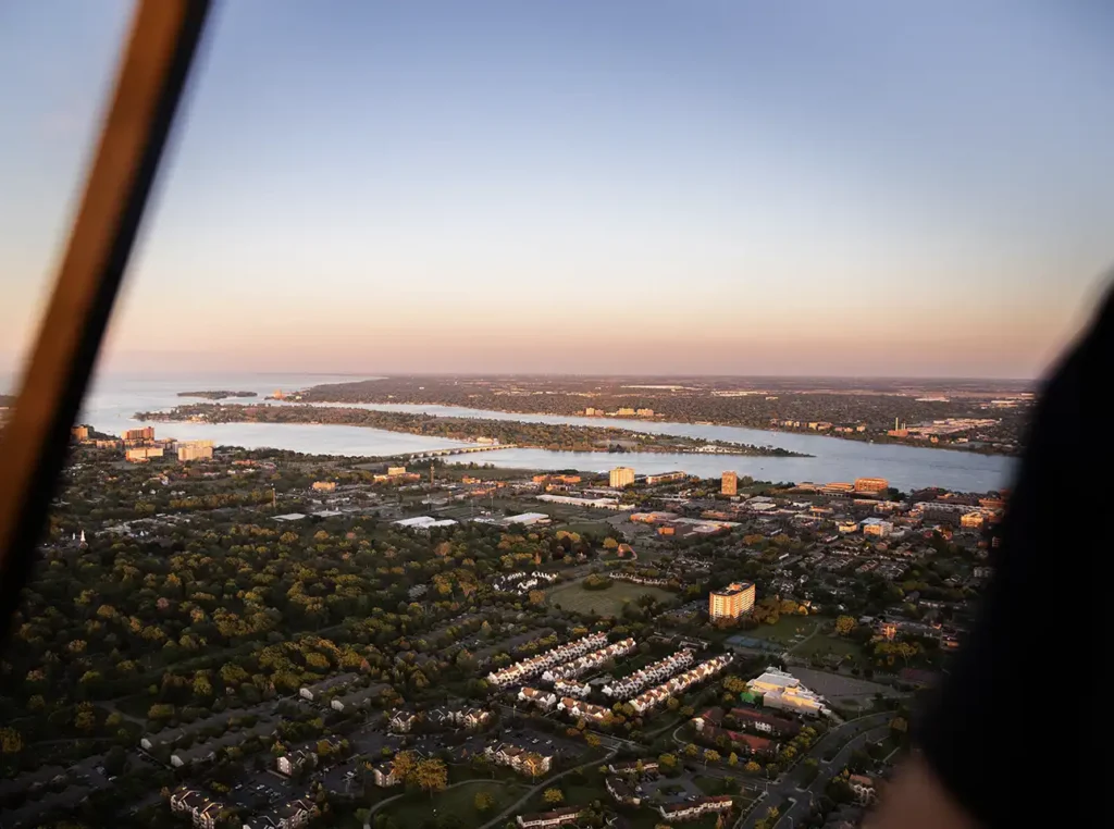 a sunset view of belle isle taken from a helicopter in detroit