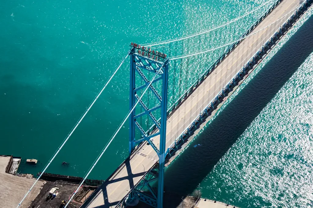 the ambassador bridge in downtown detroit taken from a helicopter tour during mid day in the sun