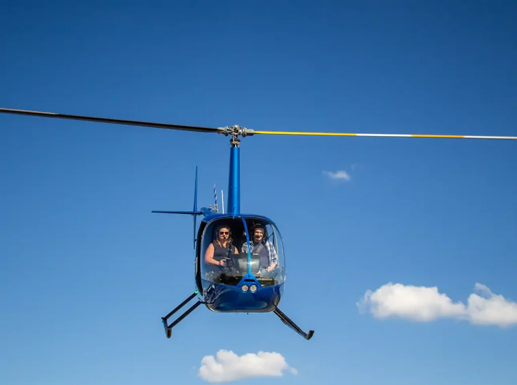 a couple taking off at ocean city airport to fly over downtown ocean city in a helicopter