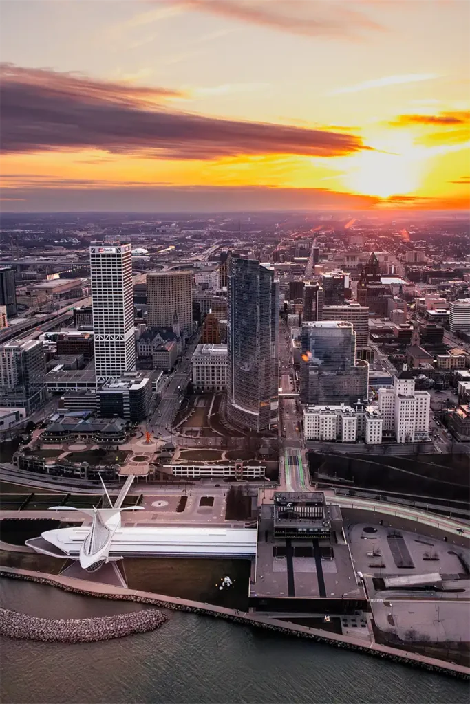 the milwaukee art museum pictured from a helicopter during a beautiful sunset