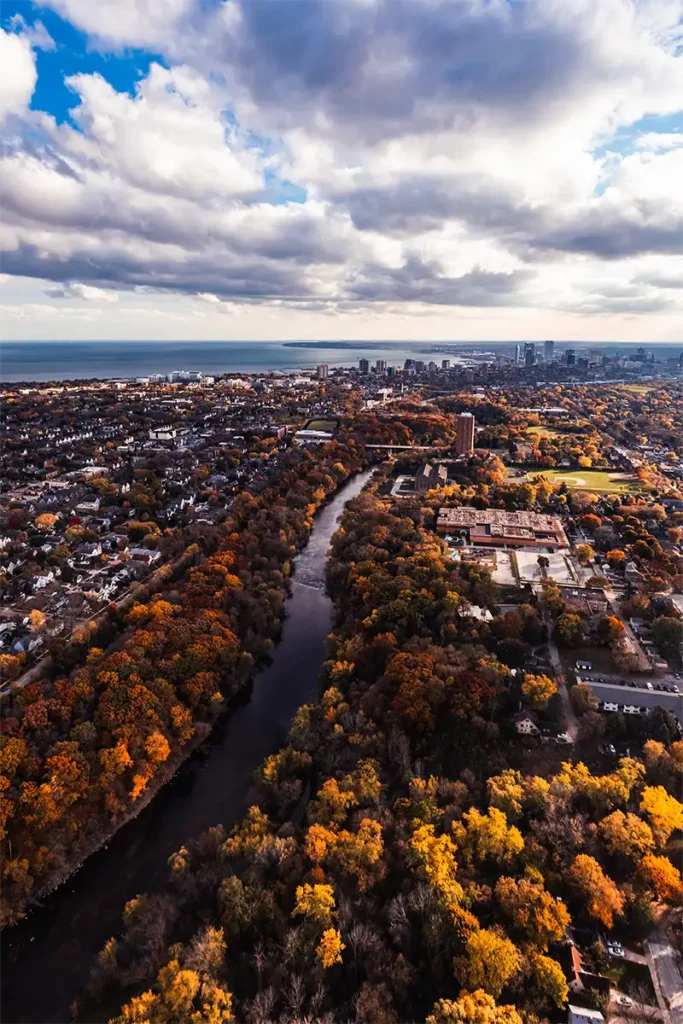 a fall time picture of the milwaukee river viewed from a helicopter tour