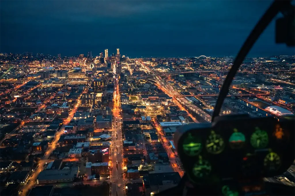 a nighttime helicopter view of downtown milwaukee