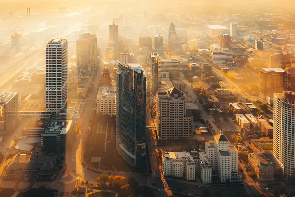 Milwaukee skyline covered in fog at golden hour, US Bank and Northwestern Mutual buildings
